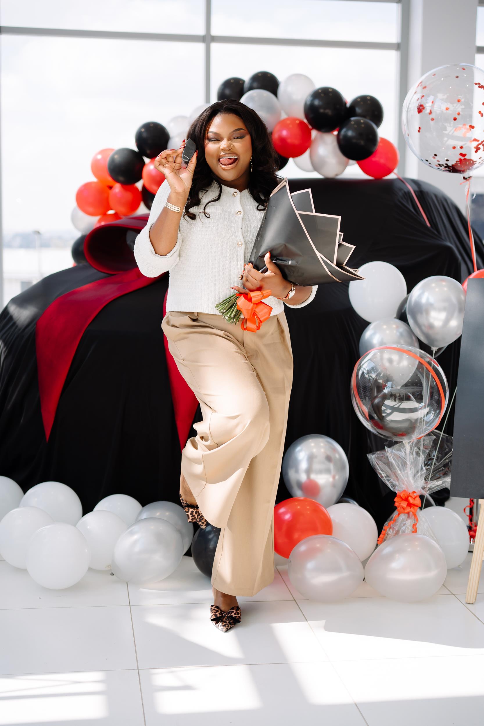 Grace Mondlana, award-winning influencer and YOBA 2025 Top Personality, posing beside the sleek new Haval H6, representing GWM South Africa as brand ambassador.