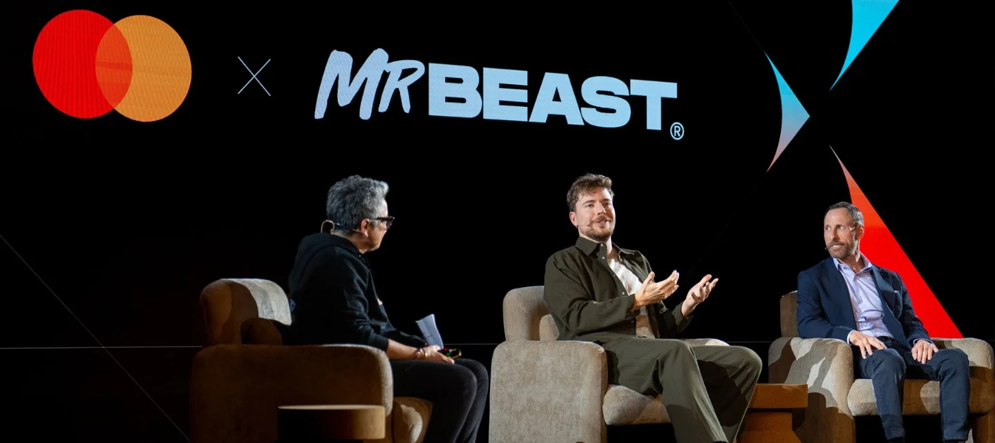 Jimmy Donaldson, known as MrBeast, with Mastercard and Beast Industries executives at a company event